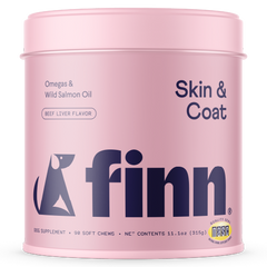Pink cylindrical container of Finn dog supplements for skin and coat with beef liver flavor, featuring a dog silhouette logo