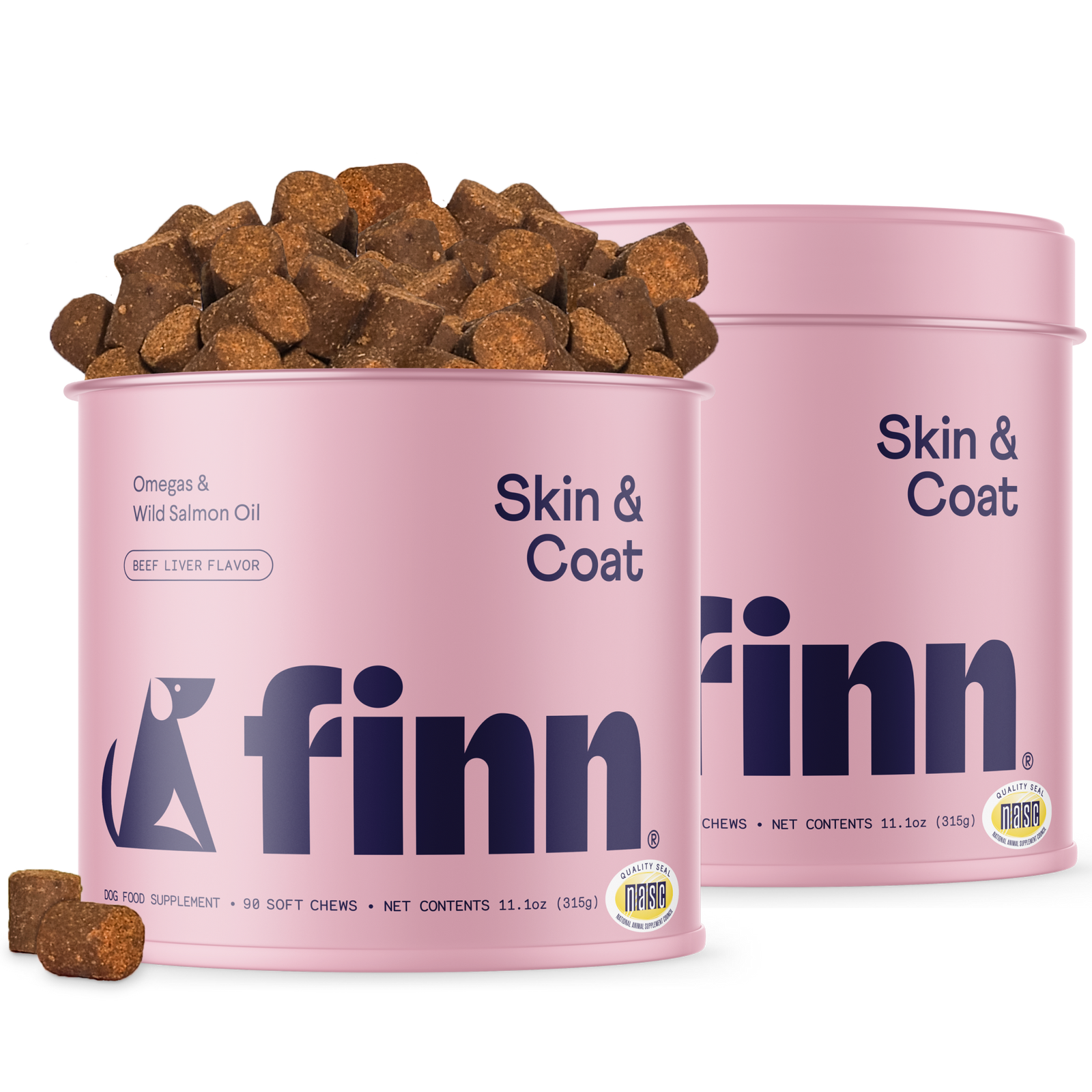 Two pink cylindrical containers of Finn Skin & Coat dog supplements with brown chew treats scattered around and spilling from one container.