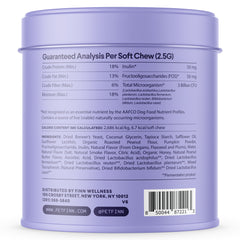Purple cylindrical tin container showing nutritional analysis and ingredients for dog probiotic soft chews