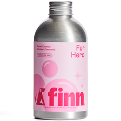 Silver aluminum bottle of Finn Fur Hero dog shampoo with pink label featuring colloidal oatmeal, aloe vera and chamomile