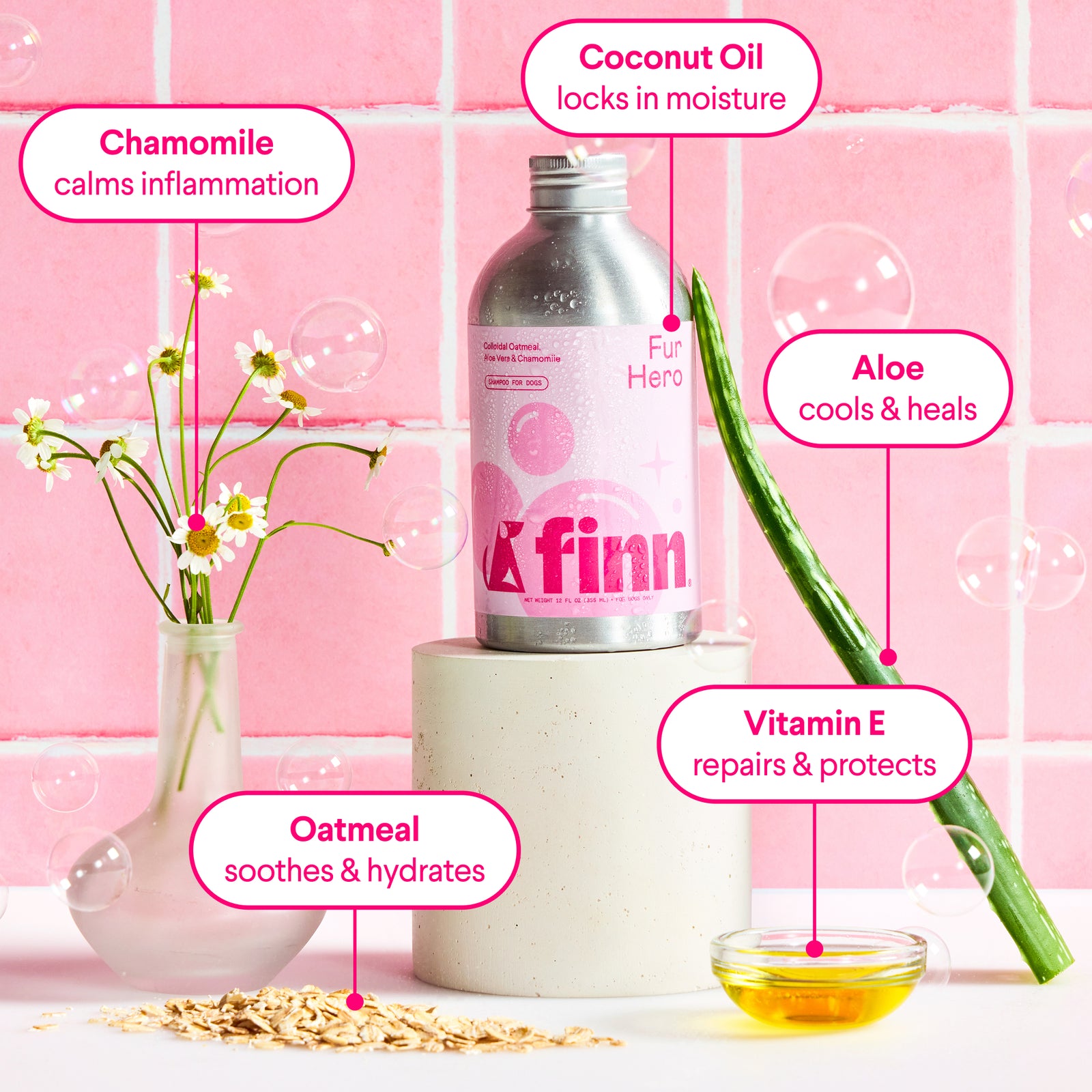 Pink-toned product display showing Finn skincare bottle with natural ingredients: chamomile flowers, oatmeal, aloe vera, and vitamin E oil with benefit labels