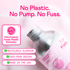 Pink-tinted product advertisement showing aluminum bottle with silver cap and pink liquid, featuring "No Plastic. No Pump. No Fuss." text and eco-friendly checkmarks