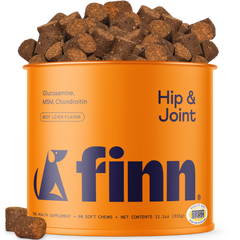 Orange canister of Finn Hip & Joint health supplements with dog treats on a white background