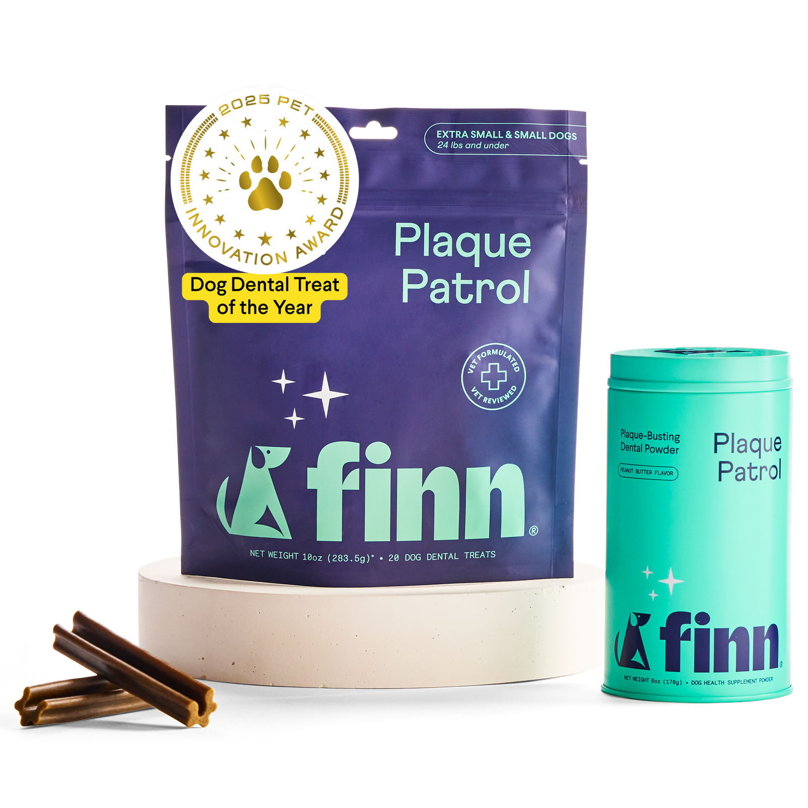 Finn brand dog dental products: purple Plaque Patrol treat pouch and teal powder container with award seal, displayed with dental chews