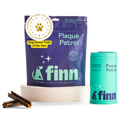 Finn brand dog dental products: purple Plaque Patrol treat pouch and teal powder container with award seal, displayed with dental chews