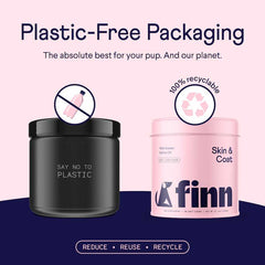 Plastic-free pet supplement packaging display showing black and pink Finn containers with recyclable symbols and "Say No to Plastic" messaging