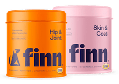 Two Finn pet supplement containers: orange "Hip & Joint" and pink "Skin & Coat" with dog silhouettes on labels